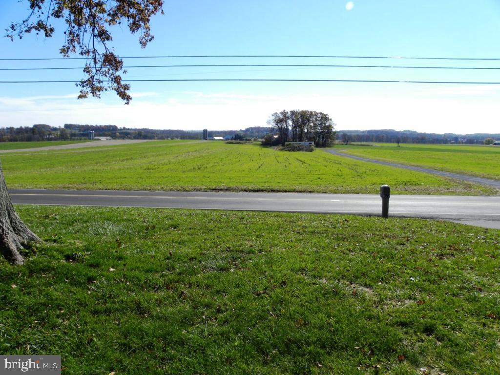 1524 Mountain Road Manheim, PA 17545 - Photo 4 of 17 a view of a golf course with a lake