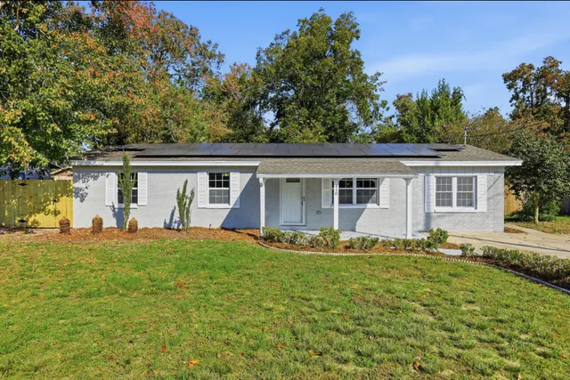 front view of a house with a big yard