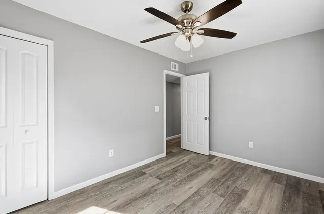 an empty room with fan