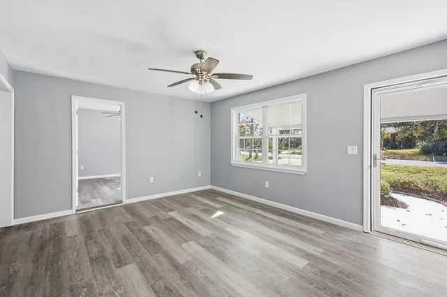 a view of an empty room with a window