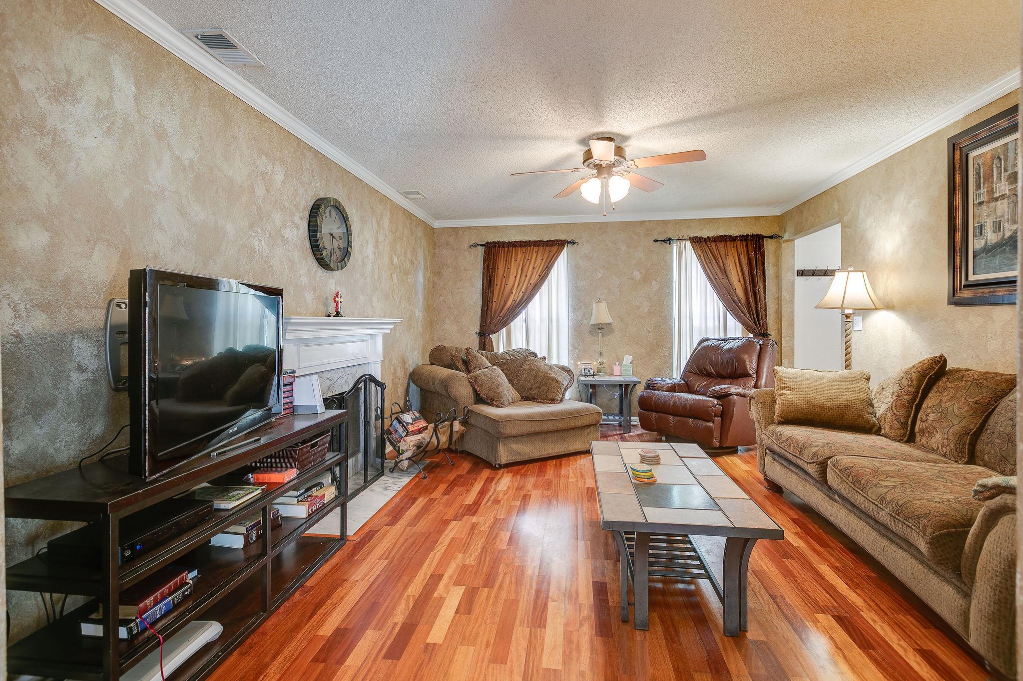 2119 Spring Hill Circle Spring Hill, TN 37174 - Photo 10 of 28 a living room with furniture and a flat screen tv