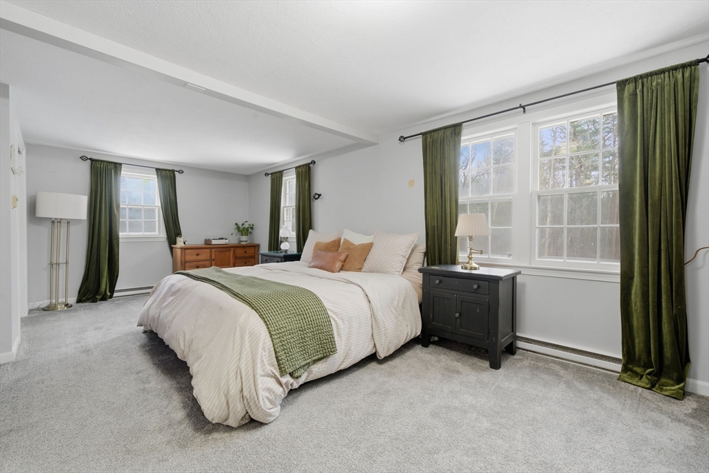 14 Seabrook Road Salisbury, MA 01952 - Photo 12 of 30 a spacious bedroom with a bed and a window