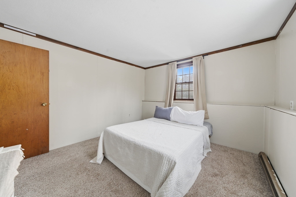 14 Seabrook Road Salisbury, MA 01952 - Photo 17 of 30 a bedroom with a bed and a window