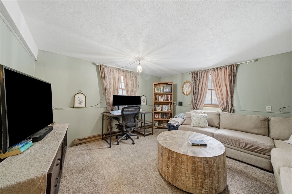 14 Seabrook Road Salisbury, MA 01952 - Photo 18 of 30 a living room with furniture and a flat screen tv