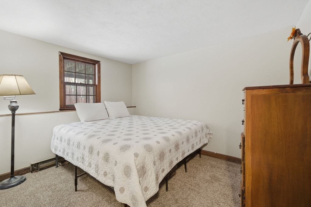 14 Seabrook Road Salisbury, MA 01952 - Photo 21 of 30 a bedroom with a bed and a night stand