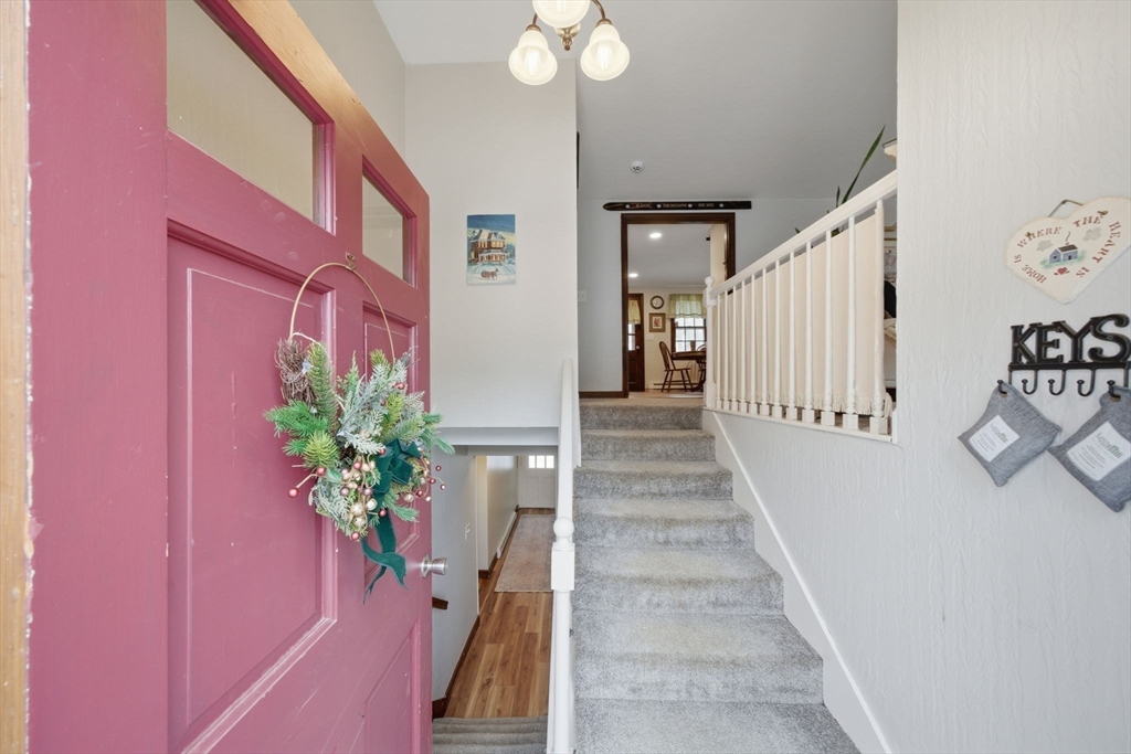 14 Seabrook Road Salisbury, MA 01952 - Photo 3 of 30 a view of a hallway with wooden floor and a potted plants
