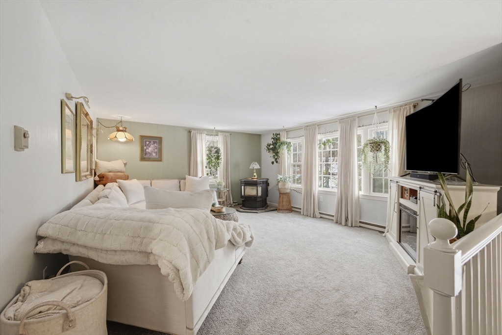 14 Seabrook Road Salisbury, MA 01952 - Photo 8 of 30 a spacious bedroom with a bed and a flat screen tv