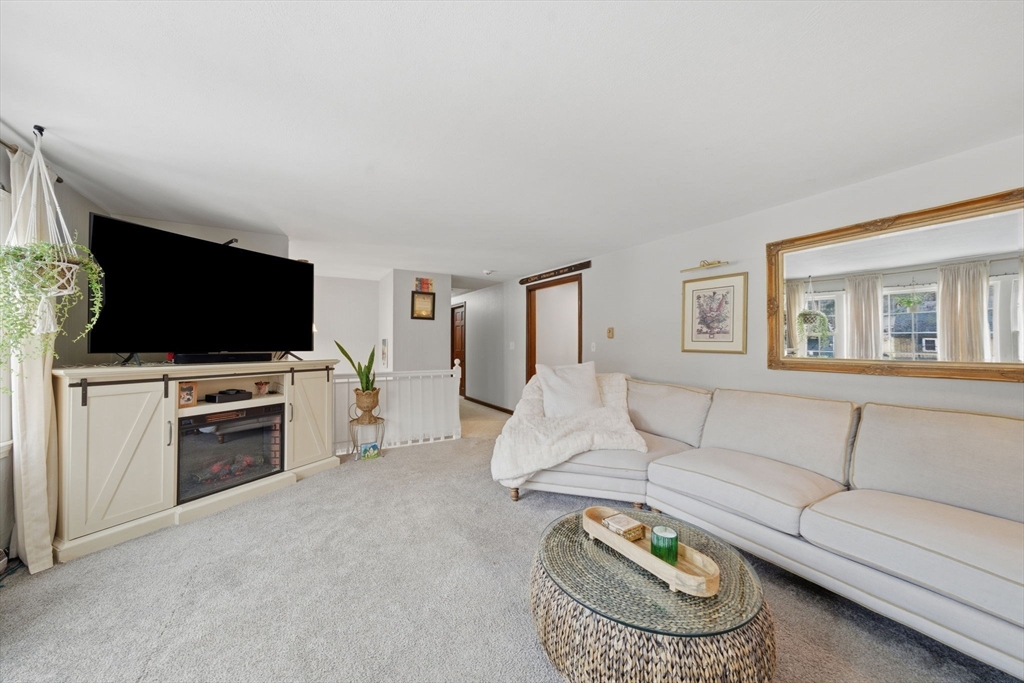 14 Seabrook Road Salisbury, MA 01952 - Photo 9 of 30 a living room with furniture and a flat screen tv