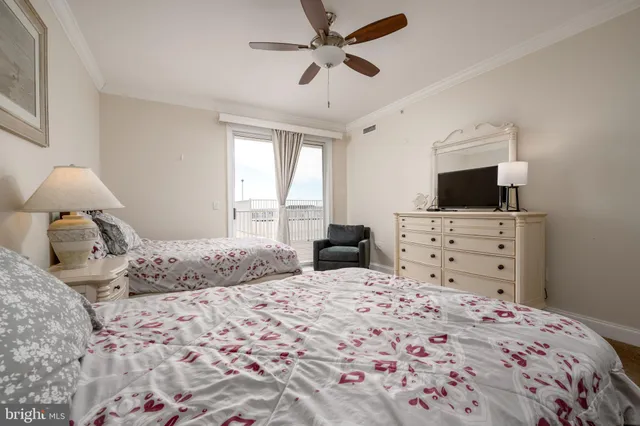 a bedroom with a bed and a television