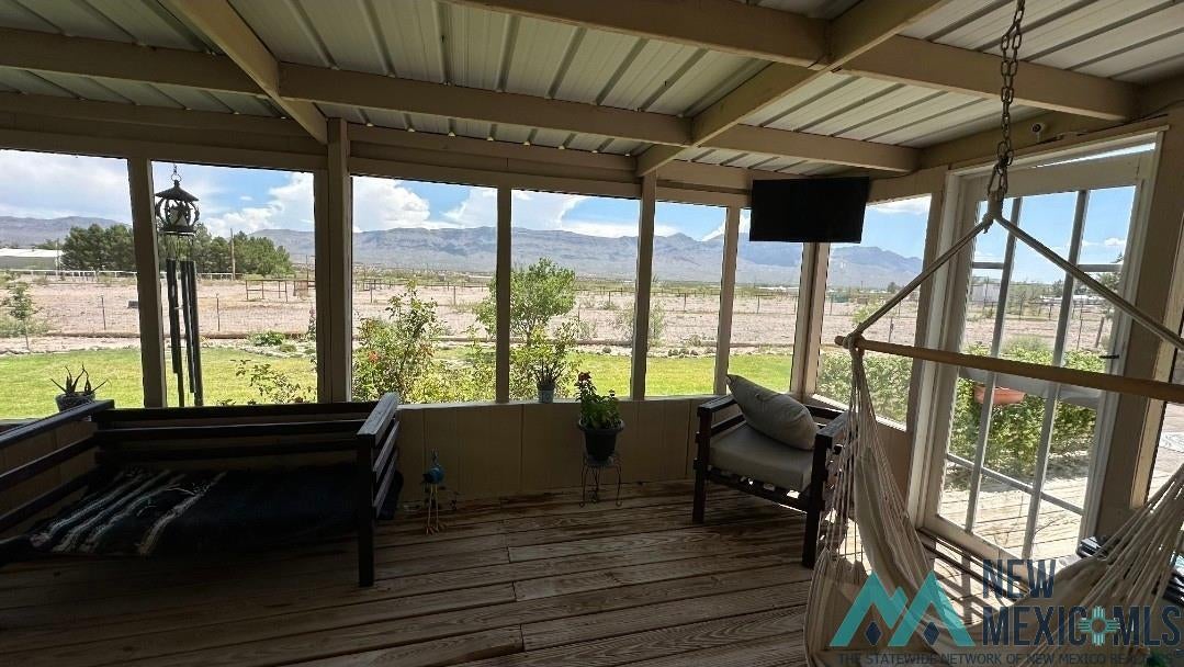 4 Midway Road Caballo, NM 87931 - Photo 26 of 43 Sunroom with beam ceiling and hardwood / wood-style floors