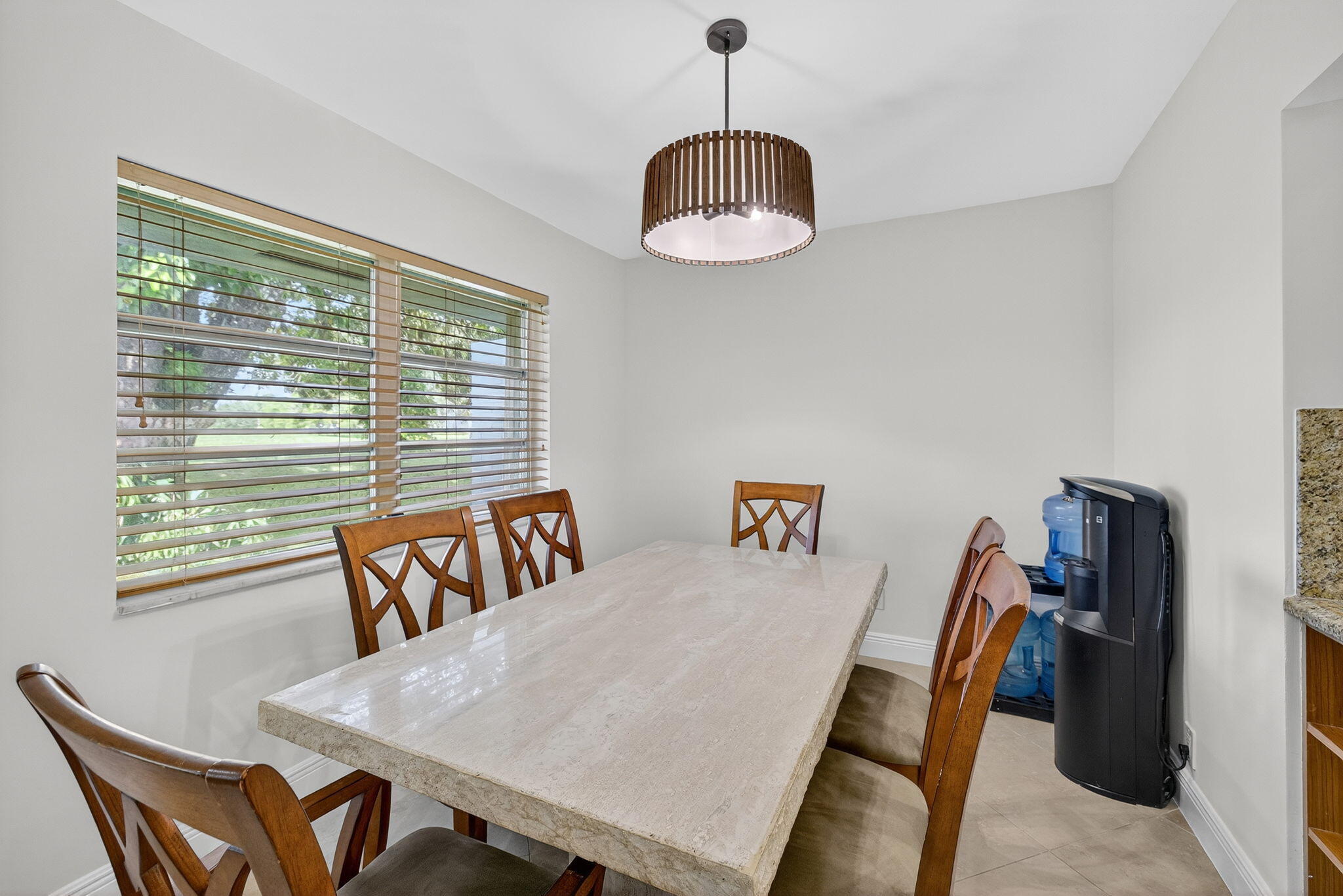 5503 Bluejack Oak Circle Tamarac, FL 33319 - Photo 13 of 35 a view of a dining room with furniture wooden floor and chandelier