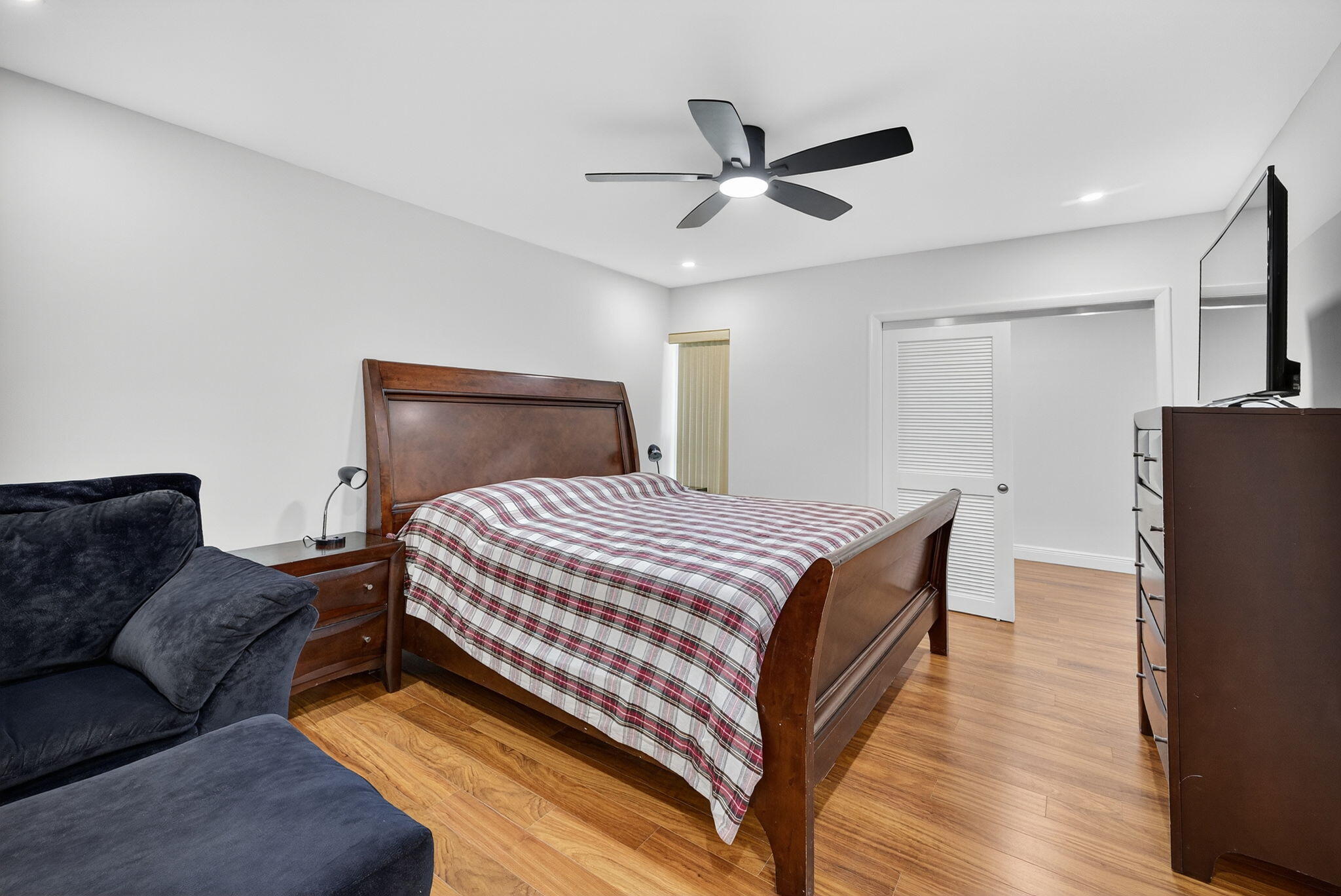 5503 Bluejack Oak Circle Tamarac, FL 33319 - Photo 18 of 35 a bed room with a bed and a couch