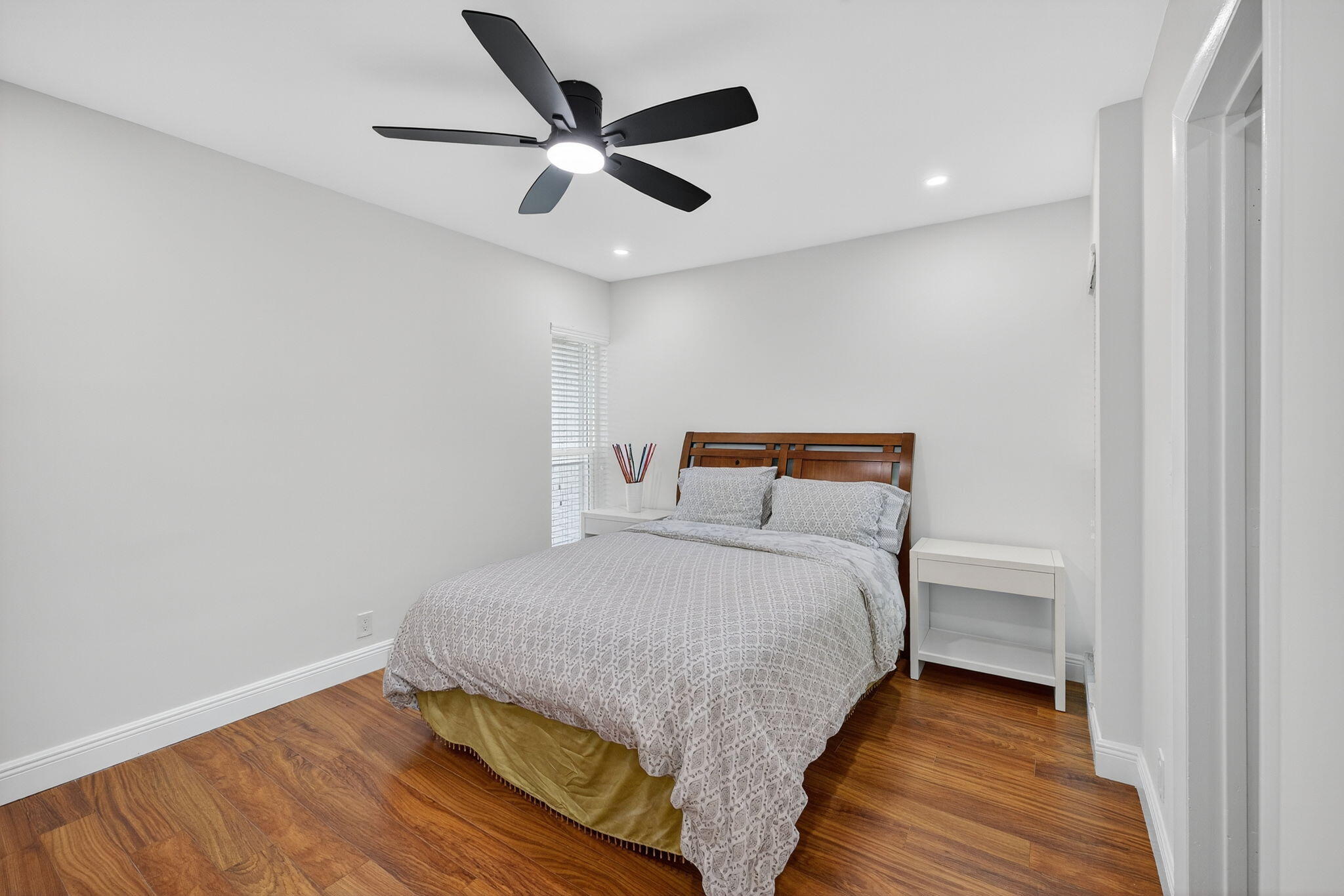 5503 Bluejack Oak Circle Tamarac, FL 33319 - Photo 24 of 35 a bedroom with a bed and a ceiling fan