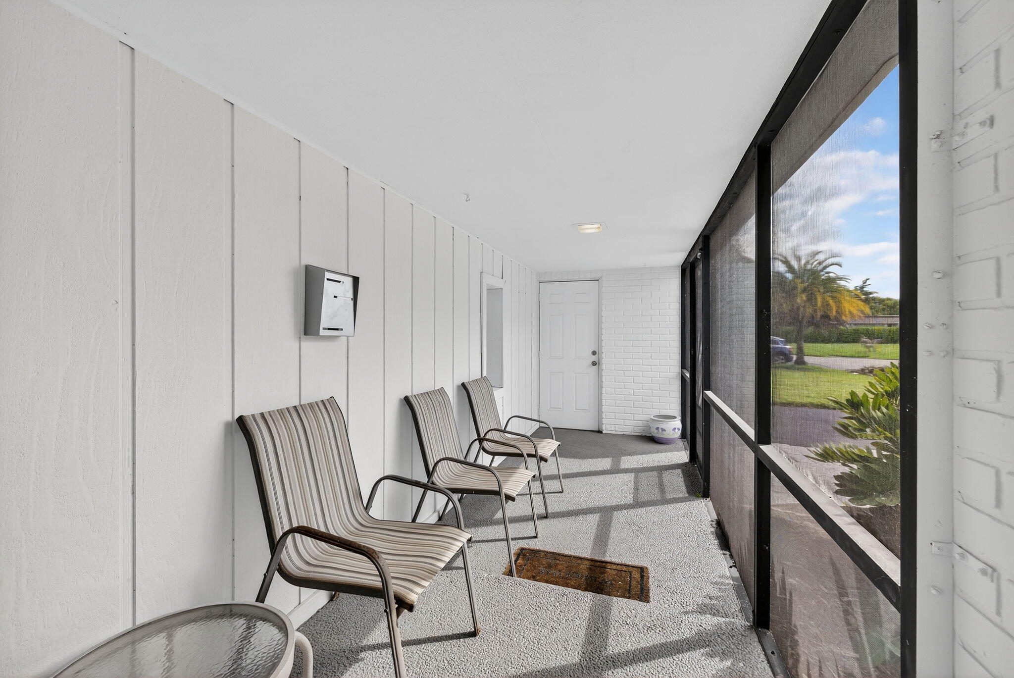 5503 Bluejack Oak Circle Tamarac, FL 33319 - Photo 4 of 35 a living room with furniture and a floor to ceiling window