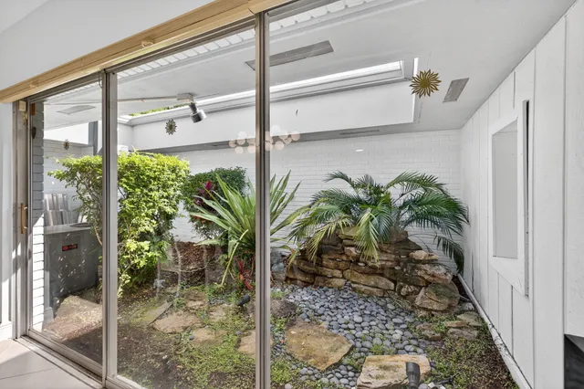 a view of potted plant in front of a window