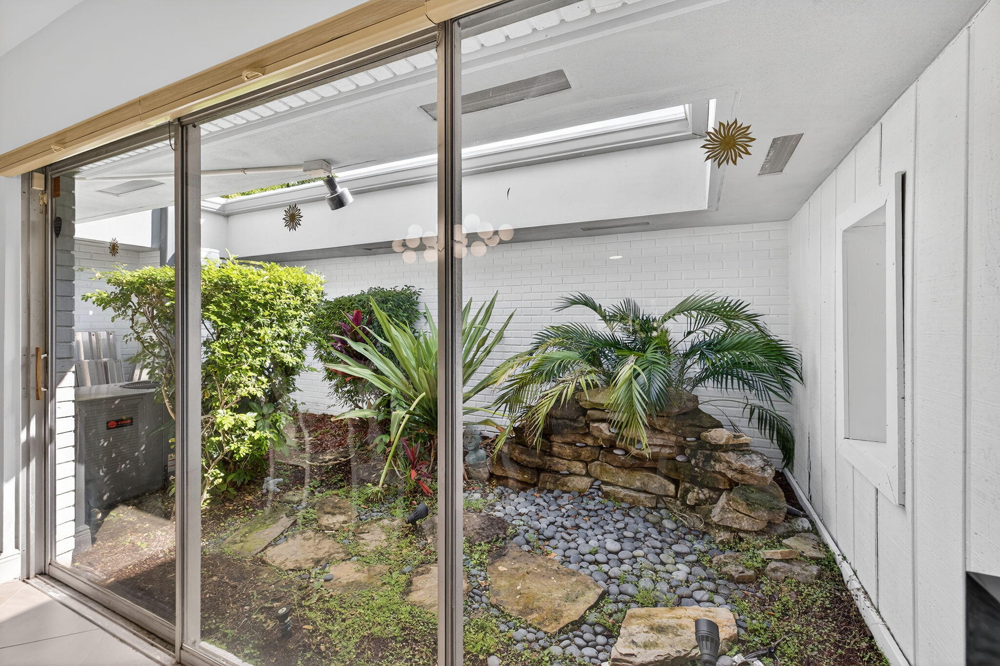 5503 Bluejack Oak Circle Tamarac, FL 33319 - Photo 6 of 35 a view of potted plant in front of a window