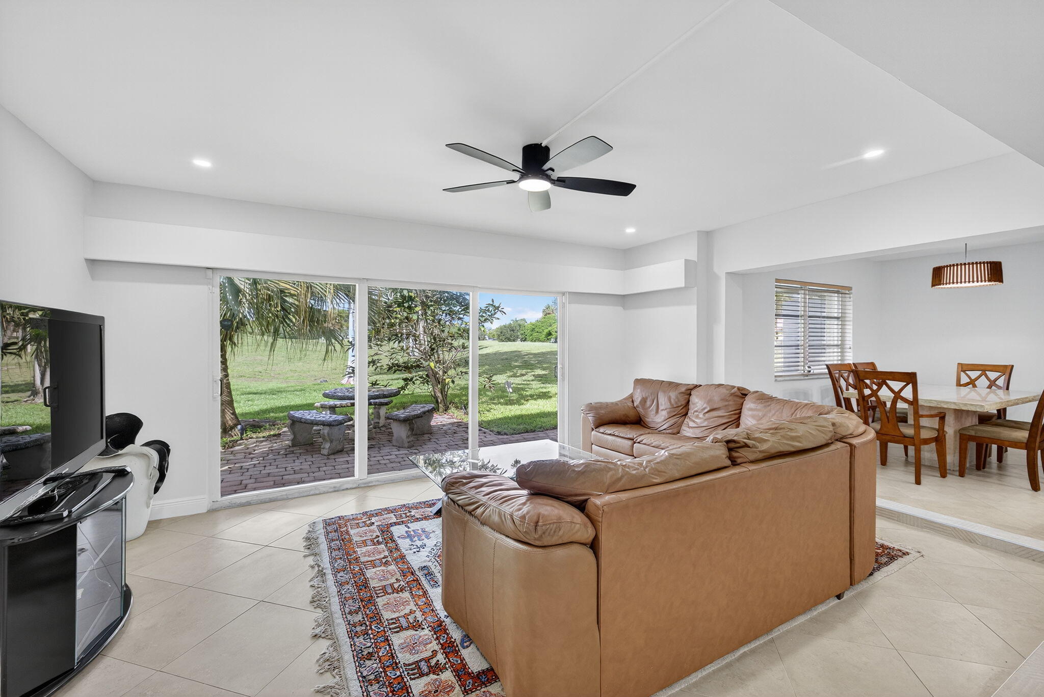 5503 Bluejack Oak Circle Tamarac, FL 33319 - Photo 10 of 35 a living room with furniture and a flat screen tv