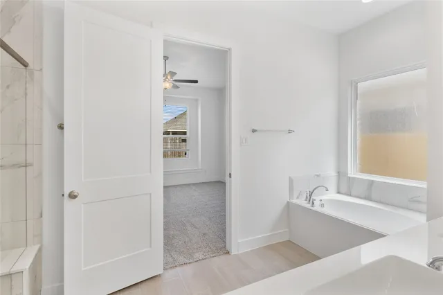 a bathroom with a bathtub and a sink