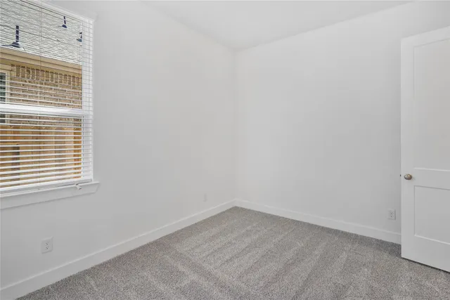 a view of a room that has a window in it