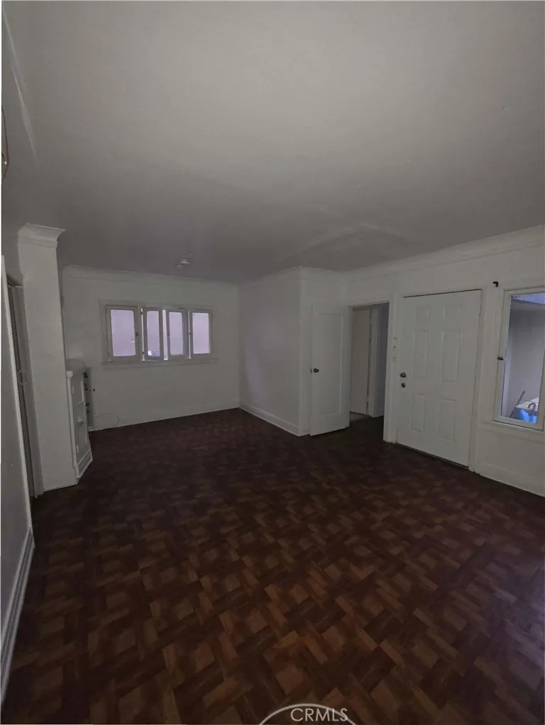 111 North Soto Street, Unit 111 Los Angeles, CA 90033 - Photo 1 of 10 a view of wooden floor and windows in a room