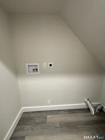 a view of room with wooden floor