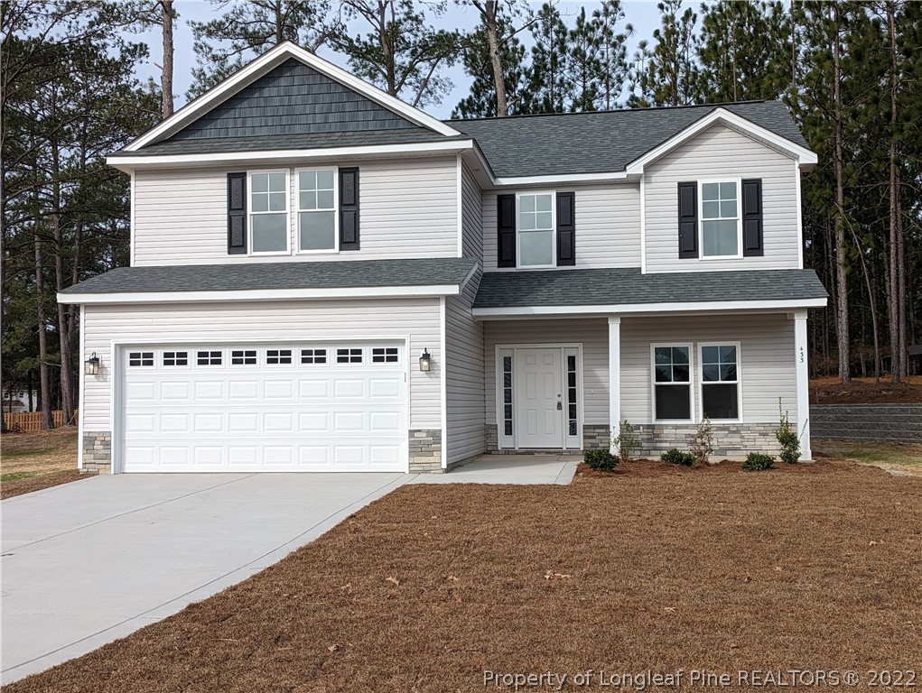433 B & B Loop Road Raeford, NC 28376 - Photo 1 of 37 a front view of a house with a yard
