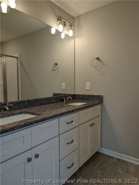 433 B & B Loop Road Raeford, NC 28376 - Photo 12 of 37 a bathroom with a granite countertop sink and a mirror
