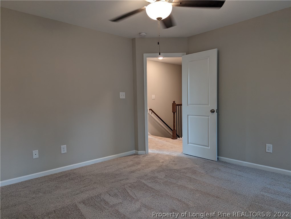 433 B & B Loop Road Raeford, NC 28376 - Photo 15 of 37 an empty room with a chandelier fan