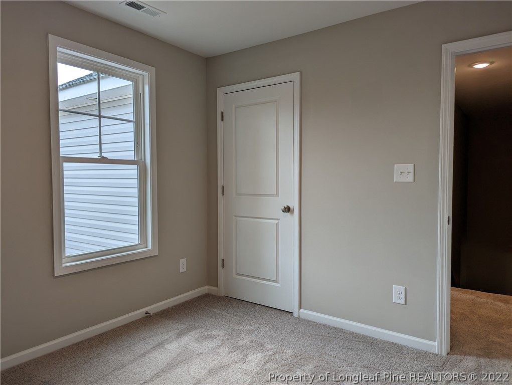 433 B & B Loop Road Raeford, NC 28376 - Photo 17 of 37 an empty room with windows and closet