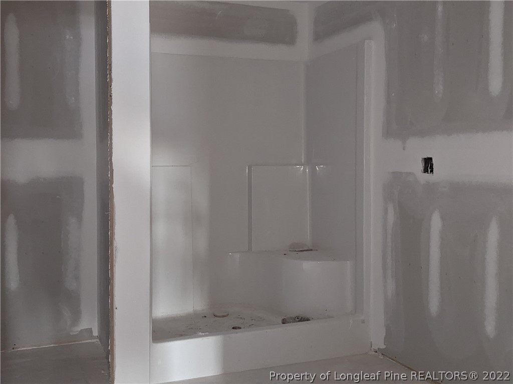 433 B & B Loop Road Raeford, NC 28376 - Photo 27 of 37 a bathroom with a bathtub