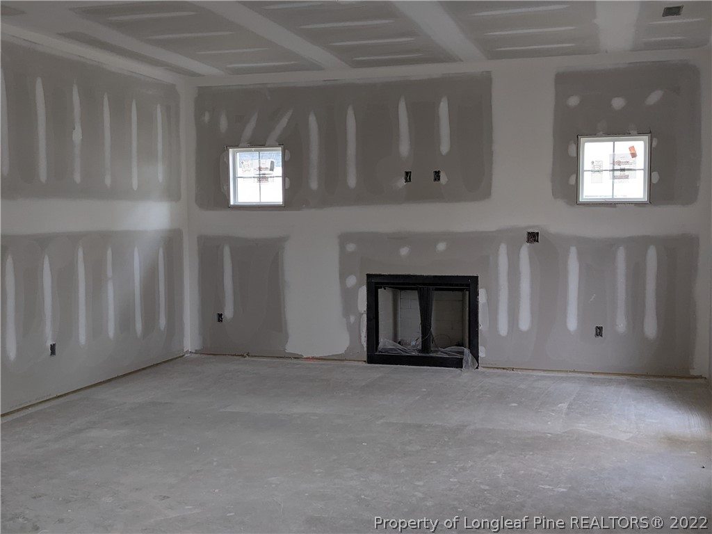 433 B & B Loop Road Raeford, NC 28376 - Photo 36 of 37 a view of an empty room with a fireplace and window