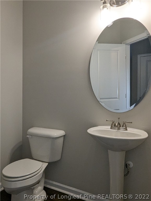 433 B & B Loop Road Raeford, NC 28376 - Photo 7 of 37 a bathroom with a sink toilet and mirror