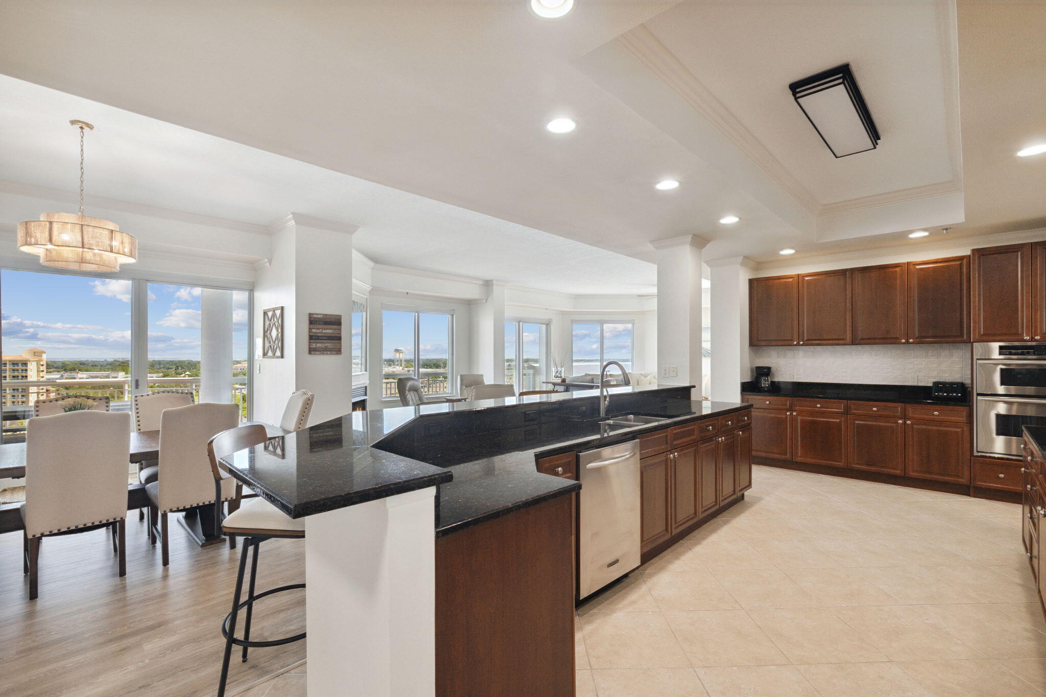 725 Gulf Shore Drive, Unit 902A Destin, FL 32541 - Photo 18 of 102 a large kitchen with stainless steel appliances lots of counter space and breakfast area