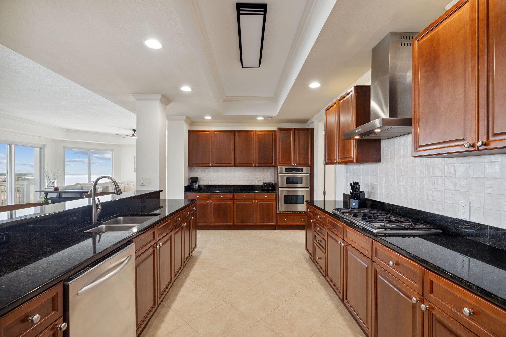 725 Gulf Shore Drive, Unit 902A Destin, FL 32541 - Photo 19 of 102 a large kitchen with stainless steel appliances granite countertop a lot of counter space and wooden floors