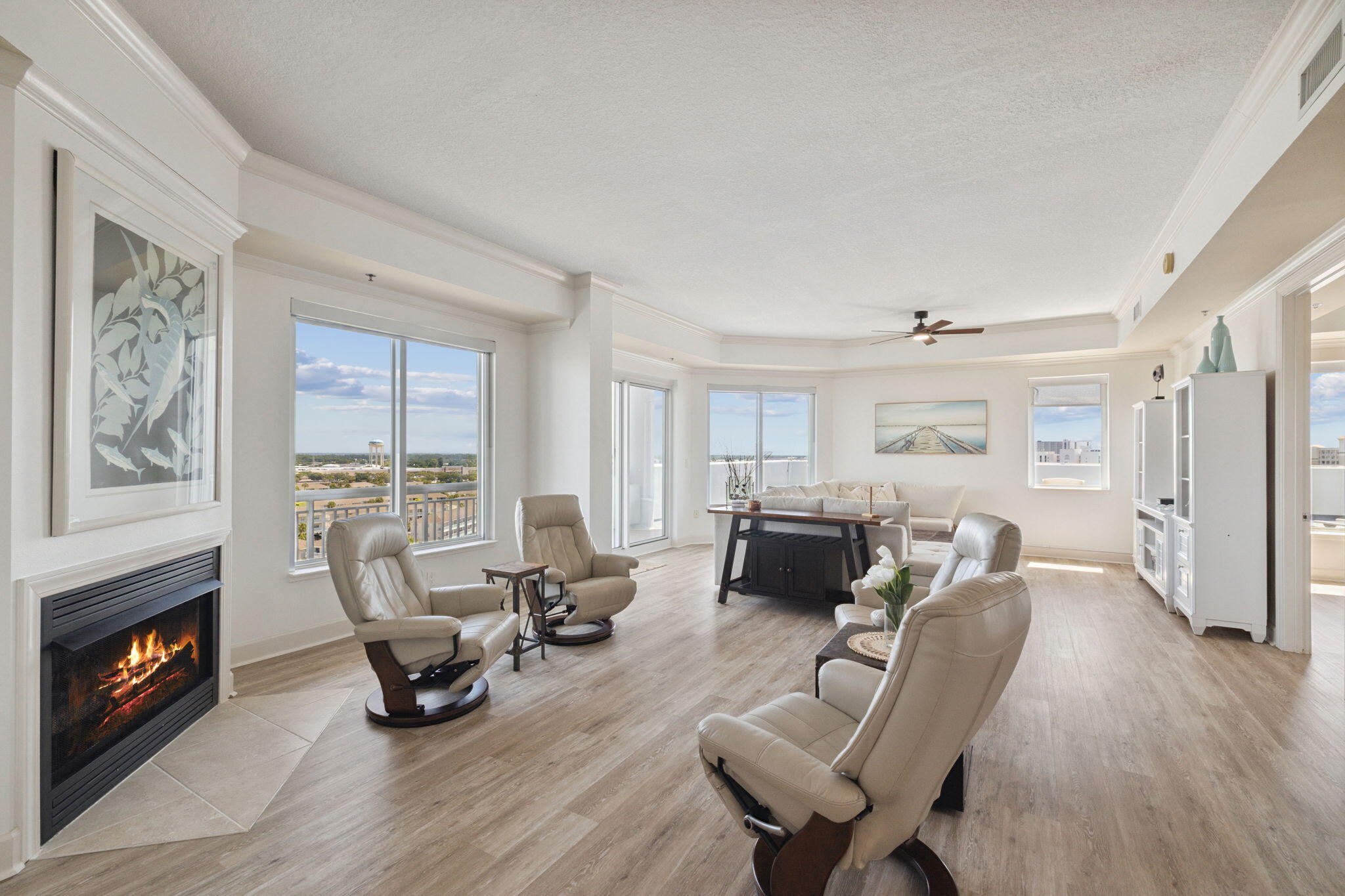 725 Gulf Shore Drive, Unit 902A Destin, FL 32541 - Photo 24 of 102 a living room with furniture a fireplace and a large window