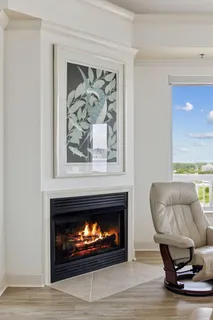 a view of a terrace with furniture and city view