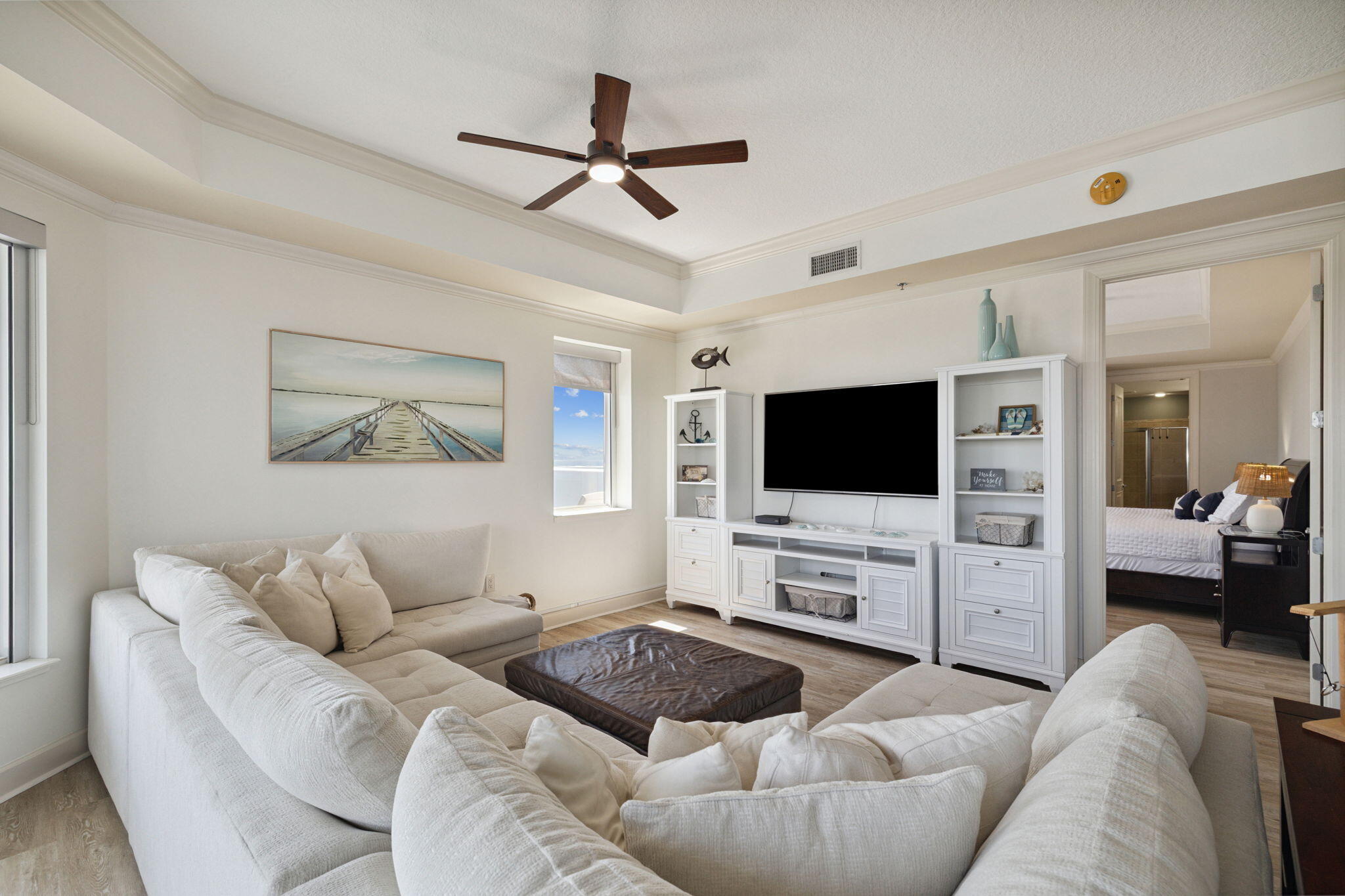 725 Gulf Shore Drive, Unit 902A Destin, FL 32541 - Photo 32 of 102 a living room with furniture and a flat screen tv
