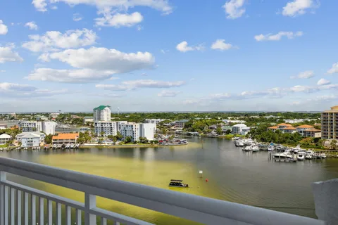 a view of a lake with boats and trees in the background