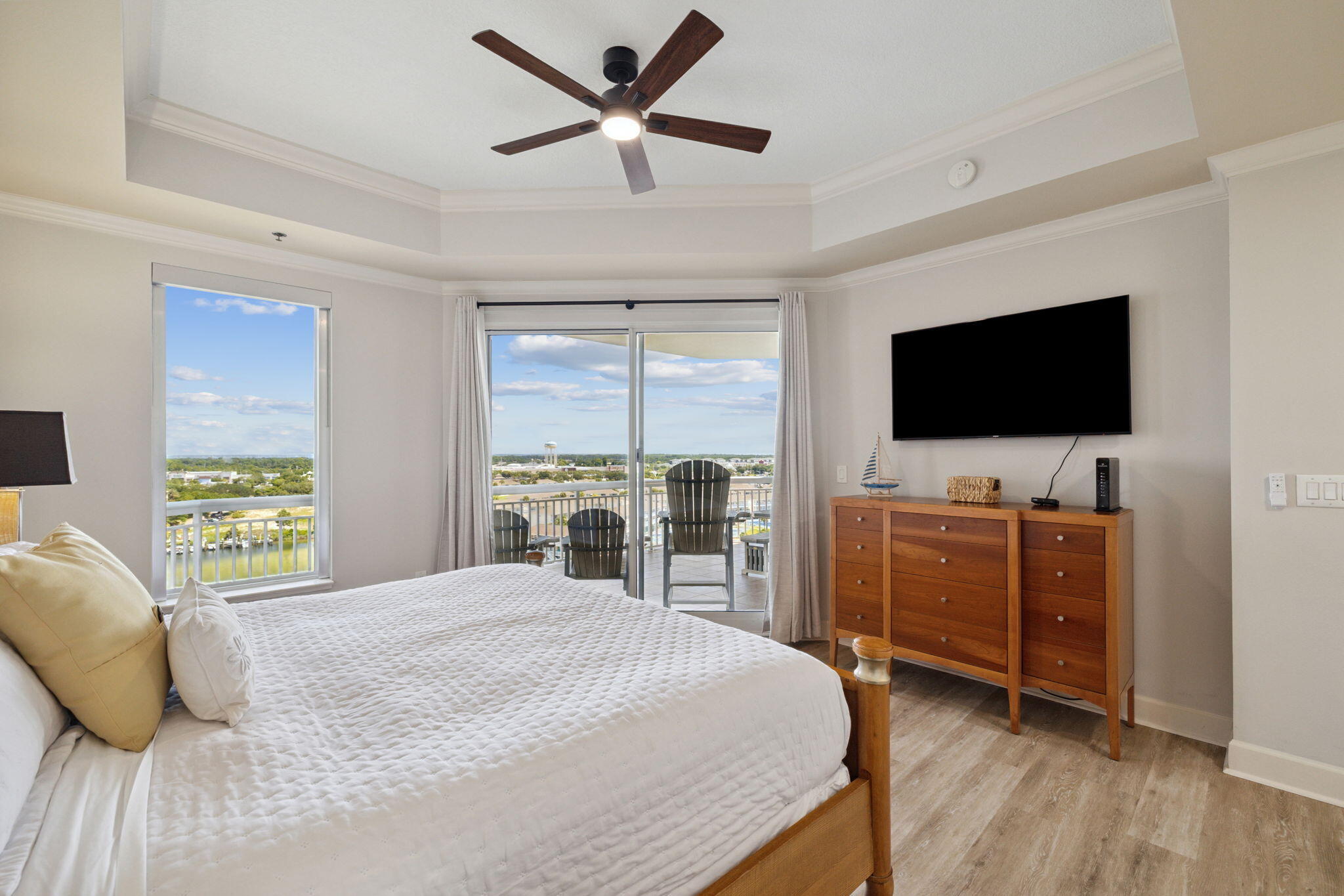 725 Gulf Shore Drive, Unit 902A Destin, FL 32541 - Photo 58 of 102 a bedroom with a bed and a flat screen tv