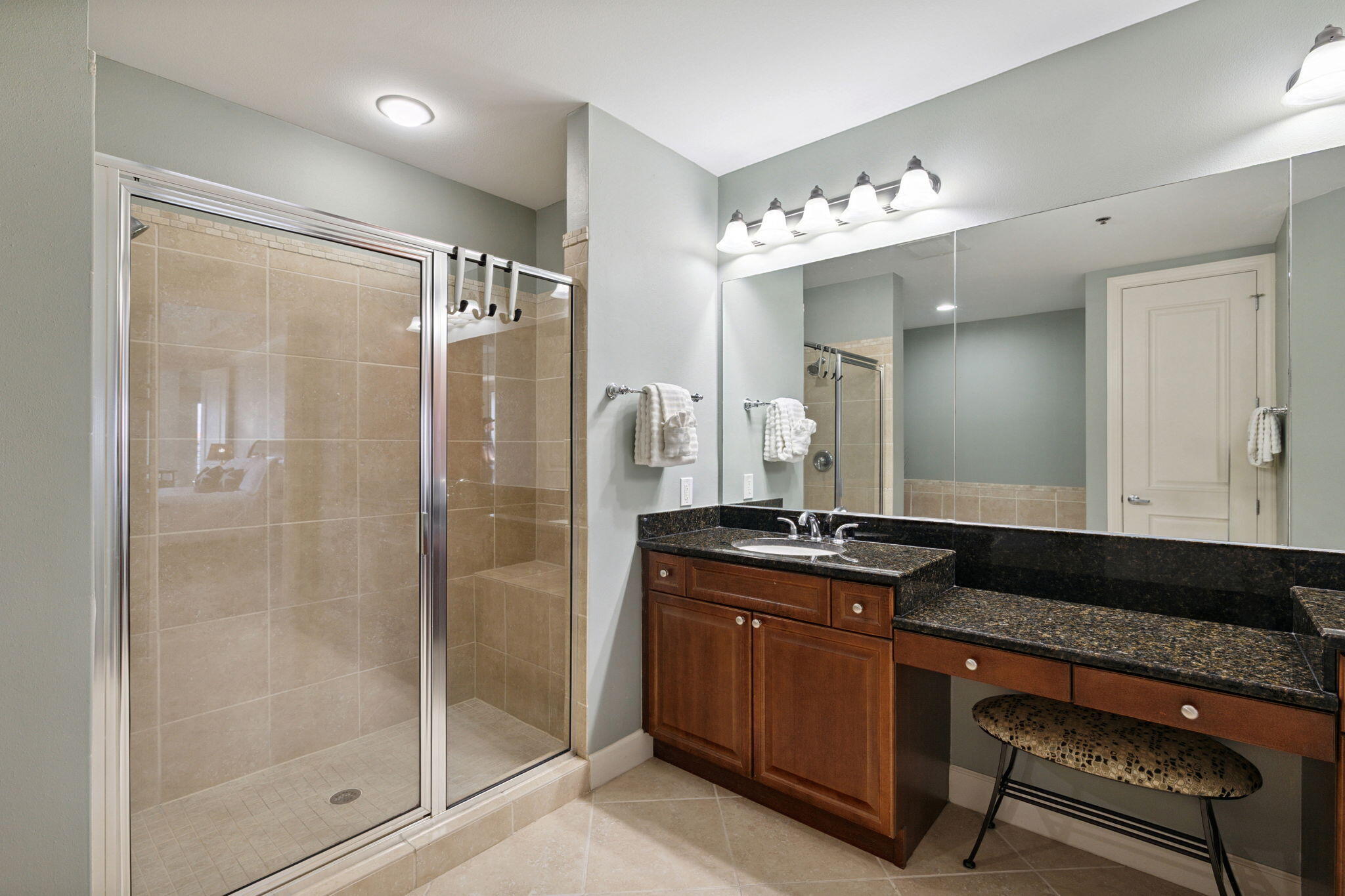 725 Gulf Shore Drive, Unit 902A Destin, FL 32541 - Photo 67 of 102 a bathroom with a granite countertop sink a mirror and a shower