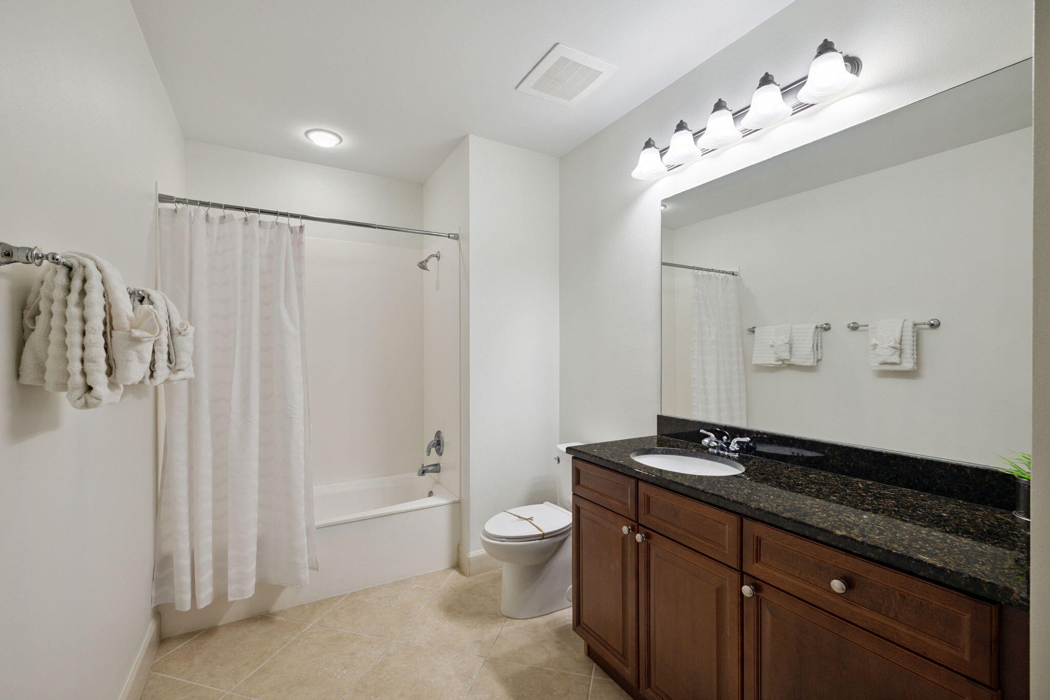 725 Gulf Shore Drive, Unit 902A Destin, FL 32541 - Photo 72 of 102 a spacious bathroom with a granite countertop sink a toilet a mirror and shower