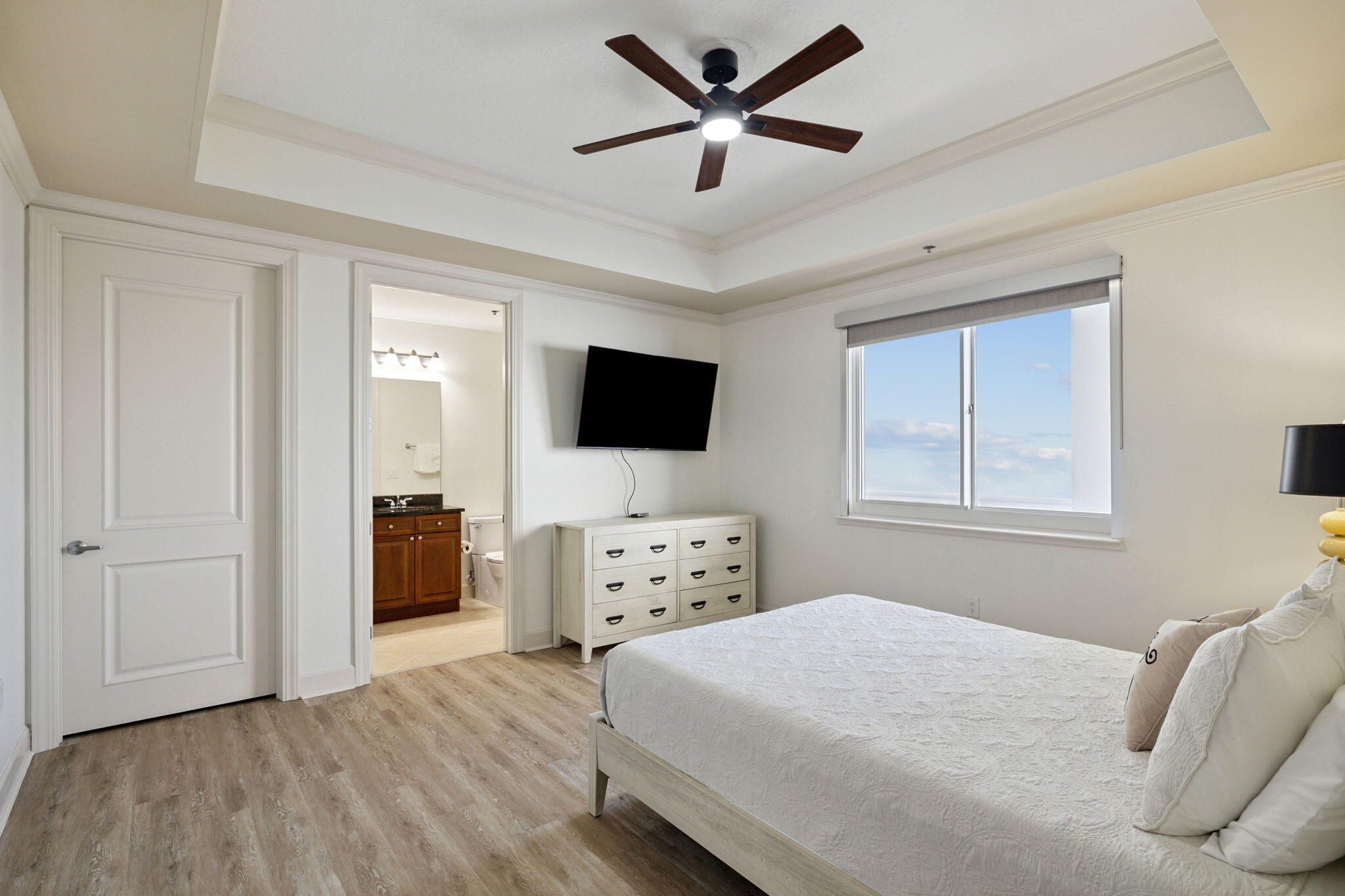 725 Gulf Shore Drive, Unit 902A Destin, FL 32541 - Photo 74 of 102 a bedroom with a bed and a flat screen tv