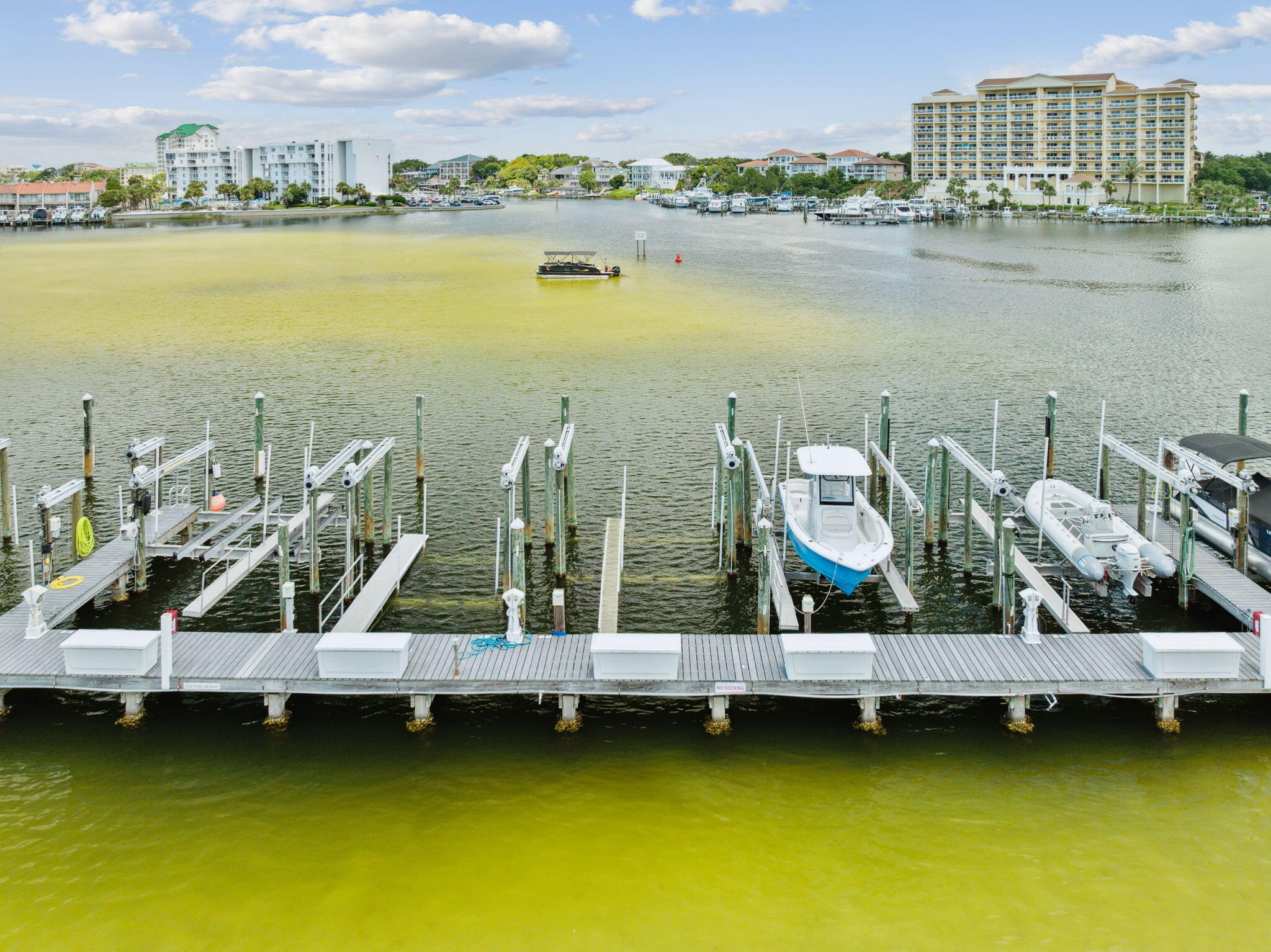 725 Gulf Shore Drive, Unit 902A Destin, FL 32541 - Photo 86 of 102 a view of a lake with boats and trees in the background