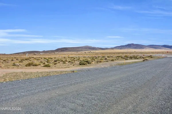 a view of an ocean beach and mountain