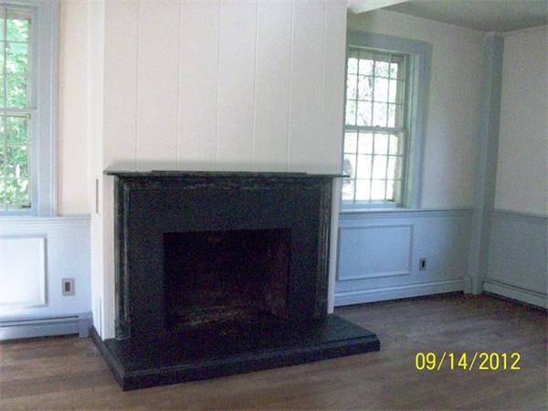 1 Rhodes Road Princeton, MA 01541 - Photo 3 of 8 an empty room with a fireplace