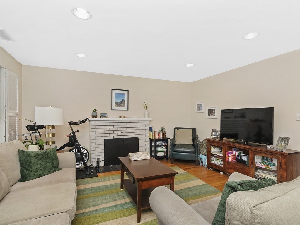 100 Main Street, Unit 2 Boston, MA 02129 - Photo 4 of 18 a living room with furniture and a flat screen tv