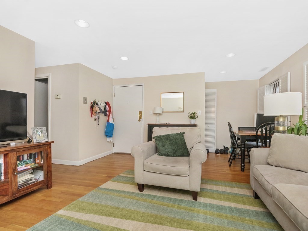 100 Main Street, Unit 2 Boston, MA 02129 - Photo 7 of 18 a living room with furniture and a flat screen tv