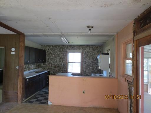 16080 Pratt Road Sandwich, IL 60548 - Photo 2 of 13 a view of a kitchen with a sink and a fireplace