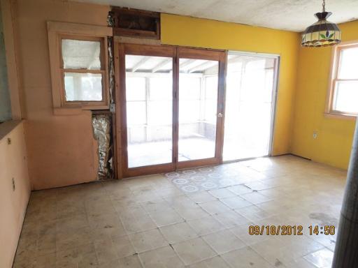 16080 Pratt Road Sandwich, IL 60548 - Photo 3 of 13 a view of an empty room with a window