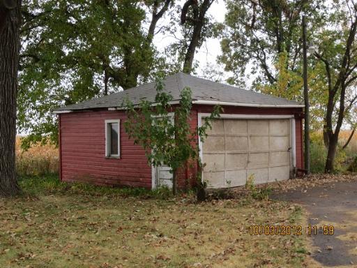 16080 Pratt Road Sandwich, IL 60548 - Photo 10 of 13 a front view of a house with a yard and garage